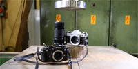 Nikon kontra Canon w prasie hydraulicznej